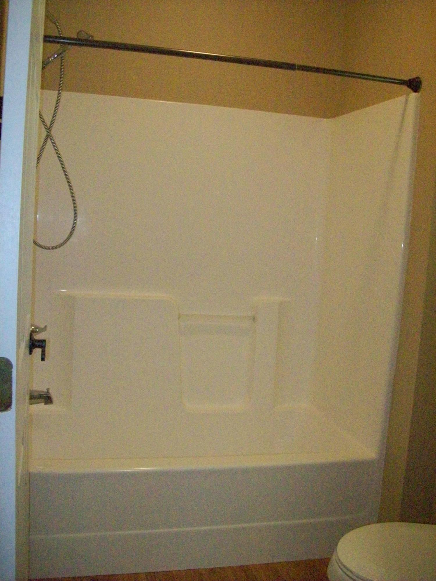 8130 Jordan Road Baker, FL 32531 - Photo 17 of 61 a bathroom with a shower and a toilet in it