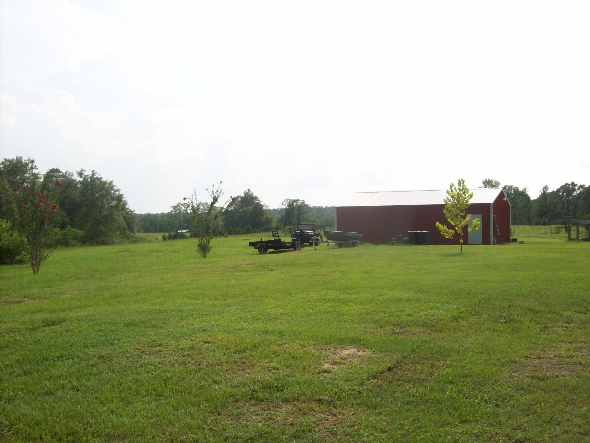 8130 Jordan Road Baker, FL 32531 - Photo 33 of 61 a view of a grassy field with trees