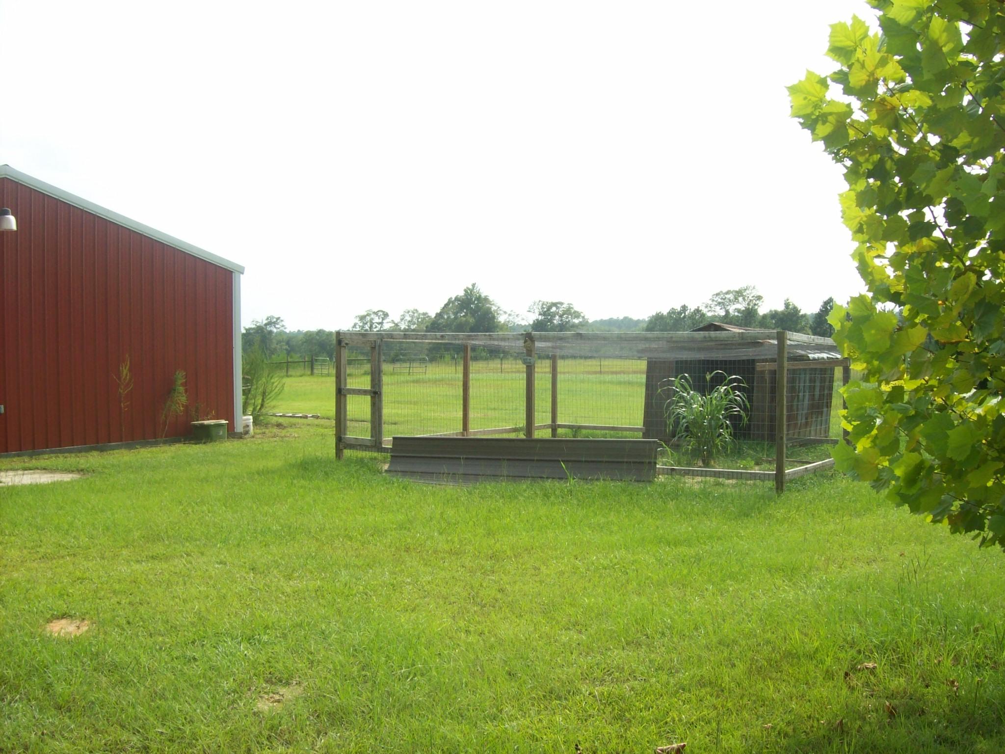 8130 Jordan Road Baker, FL 32531 - Photo 35 of 61 a view of a backyard with a garden and entertaining space
