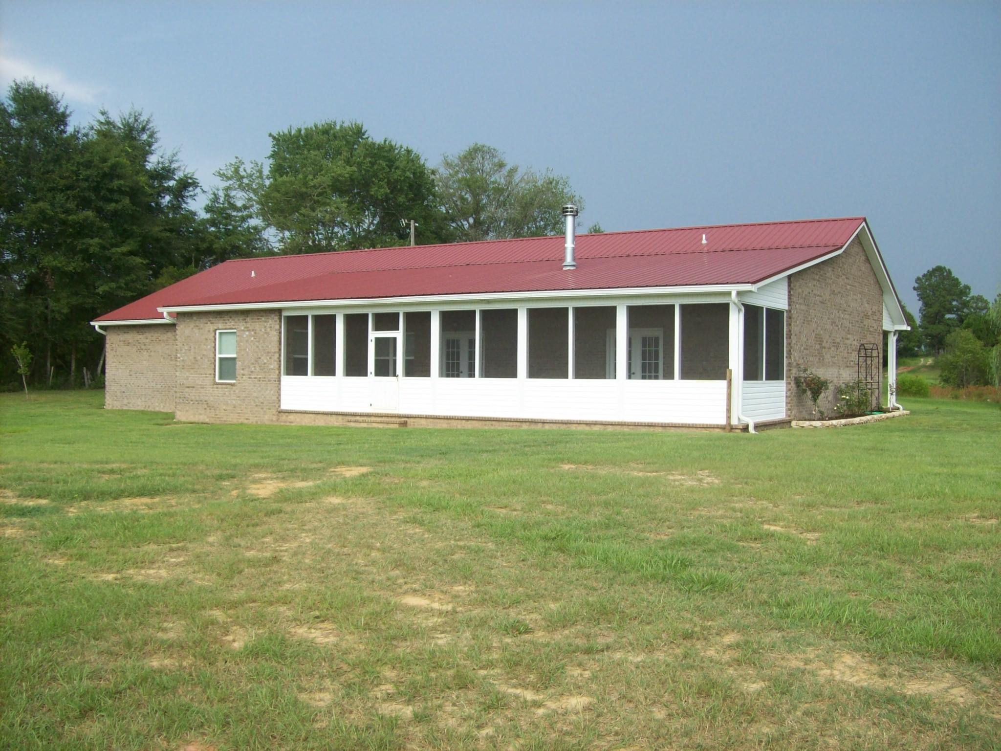 8130 Jordan Road Baker, FL 32531 - Photo 39 of 61 a view of a house with a backyard and windows