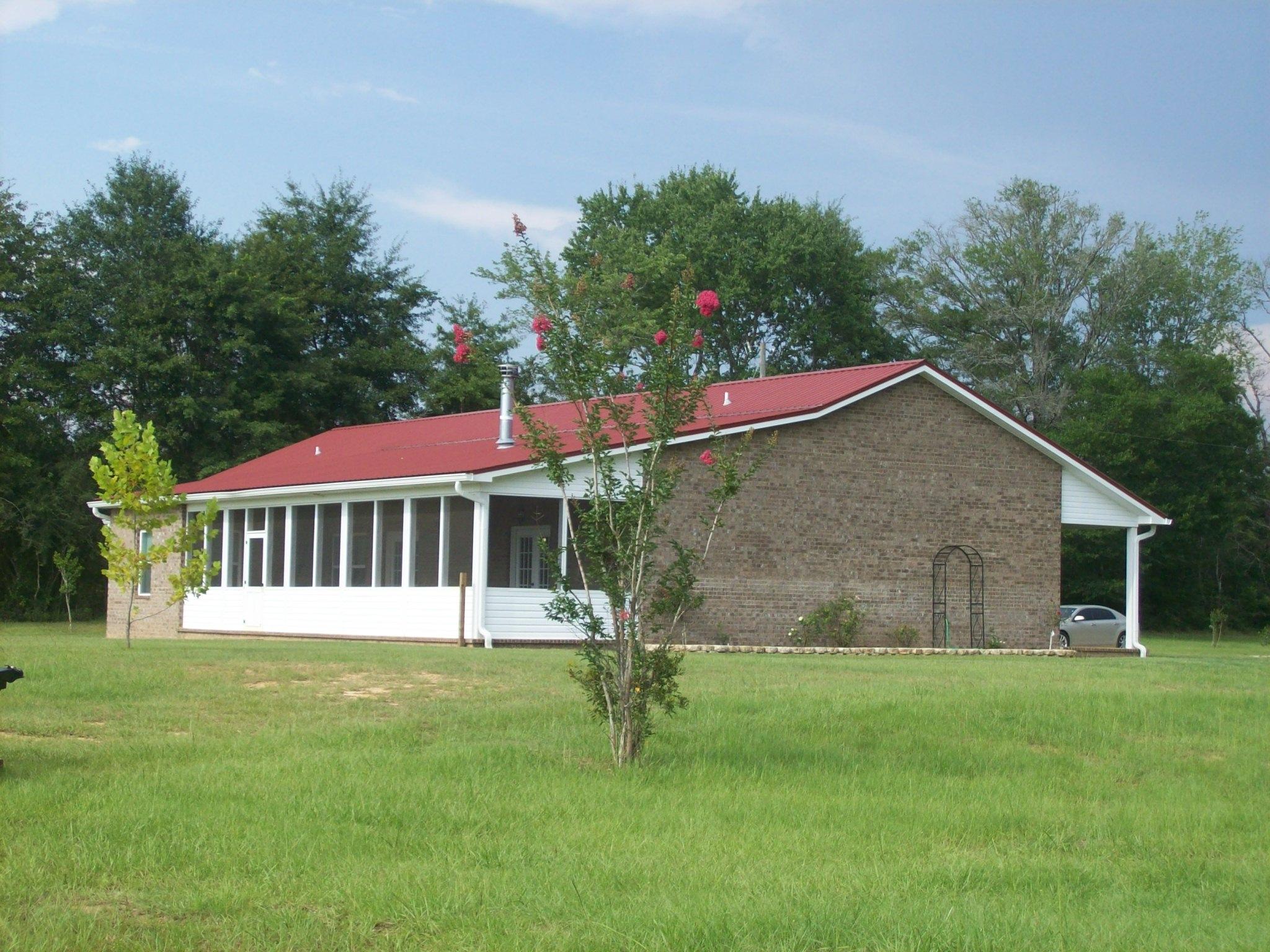 8130 Jordan Road Baker, FL 32531 - Photo 43 of 61 a house with green field in front of it