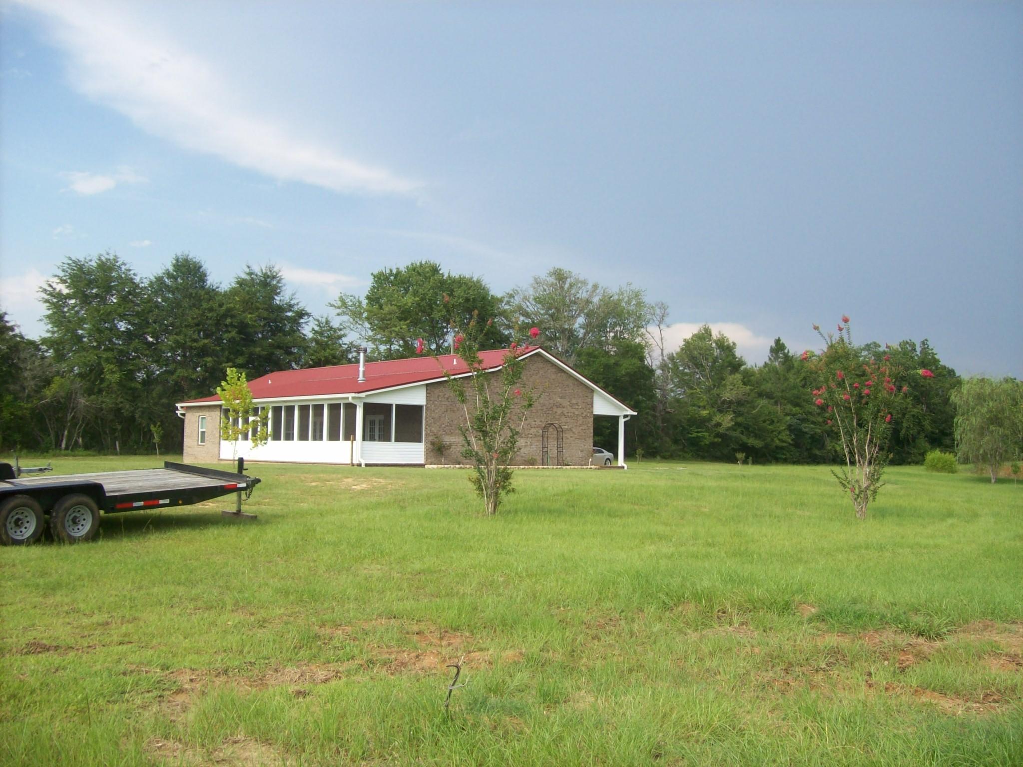 8130 Jordan Road Baker, FL 32531 - Photo 44 of 61 a front view of a house with a yard