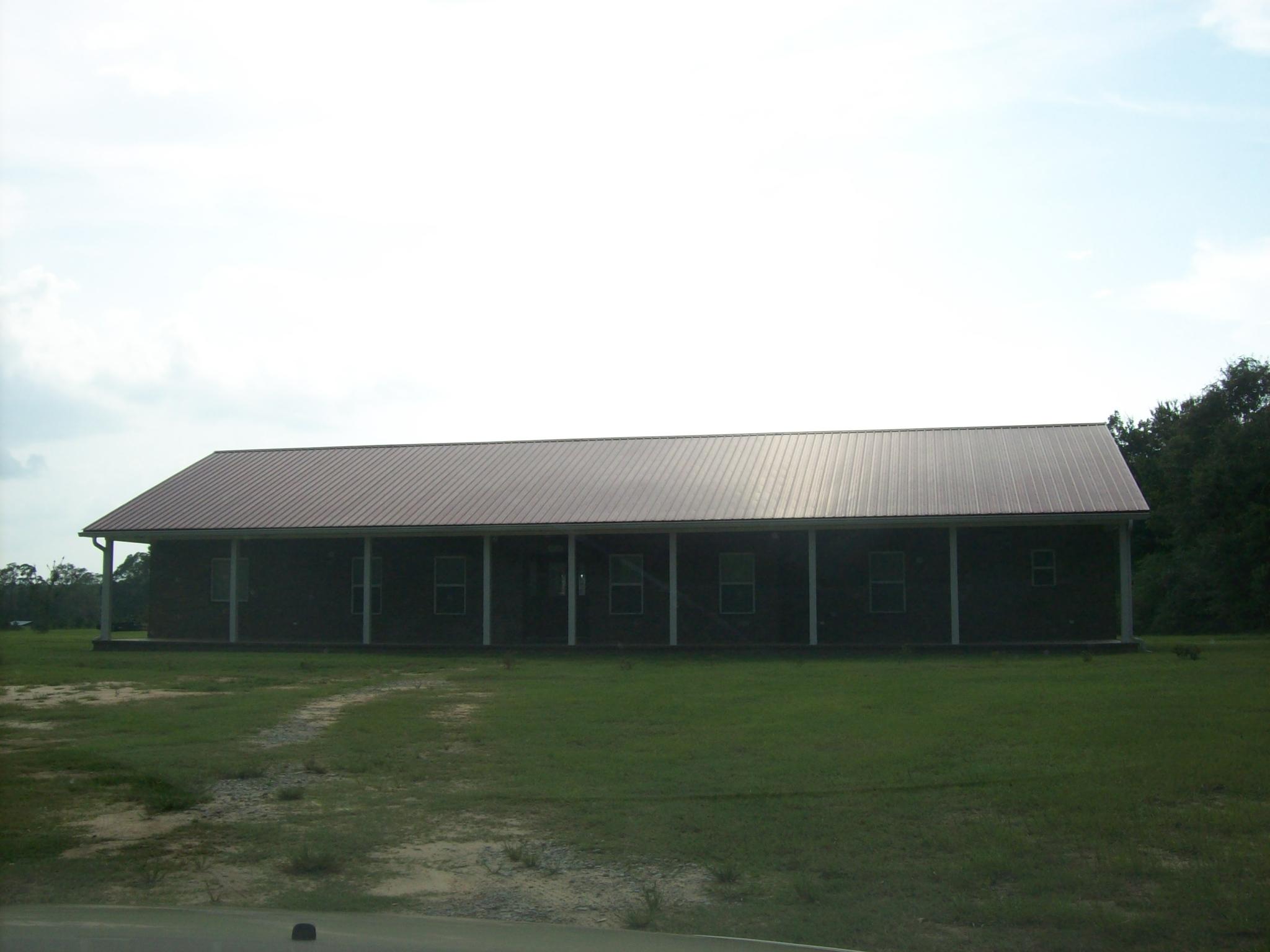 8130 Jordan Road Baker, FL 32531 - Photo 50 of 61 a front view of a house with a garden