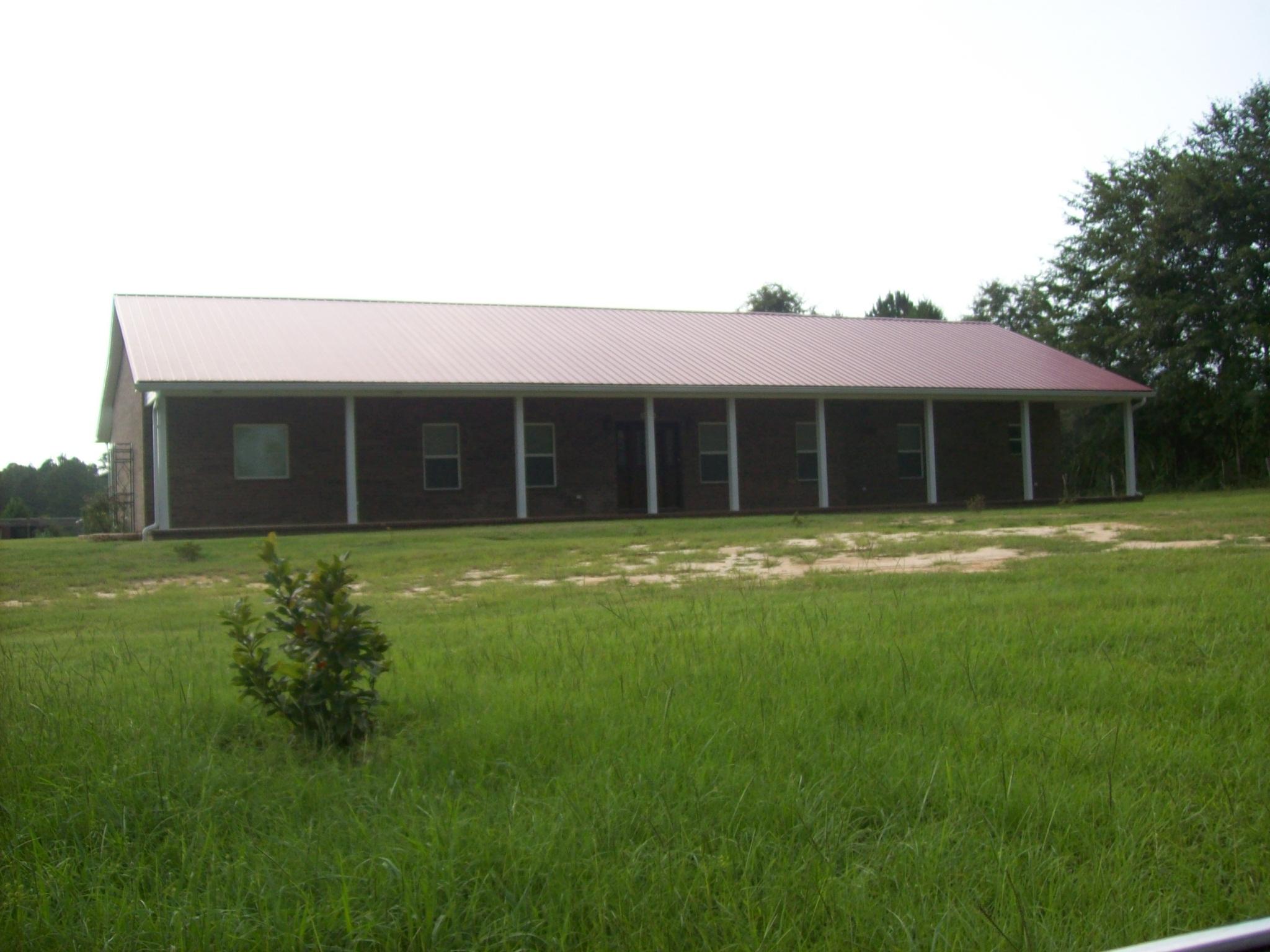 8130 Jordan Road Baker, FL 32531 - Photo 58 of 61 a view of a house with a backyard