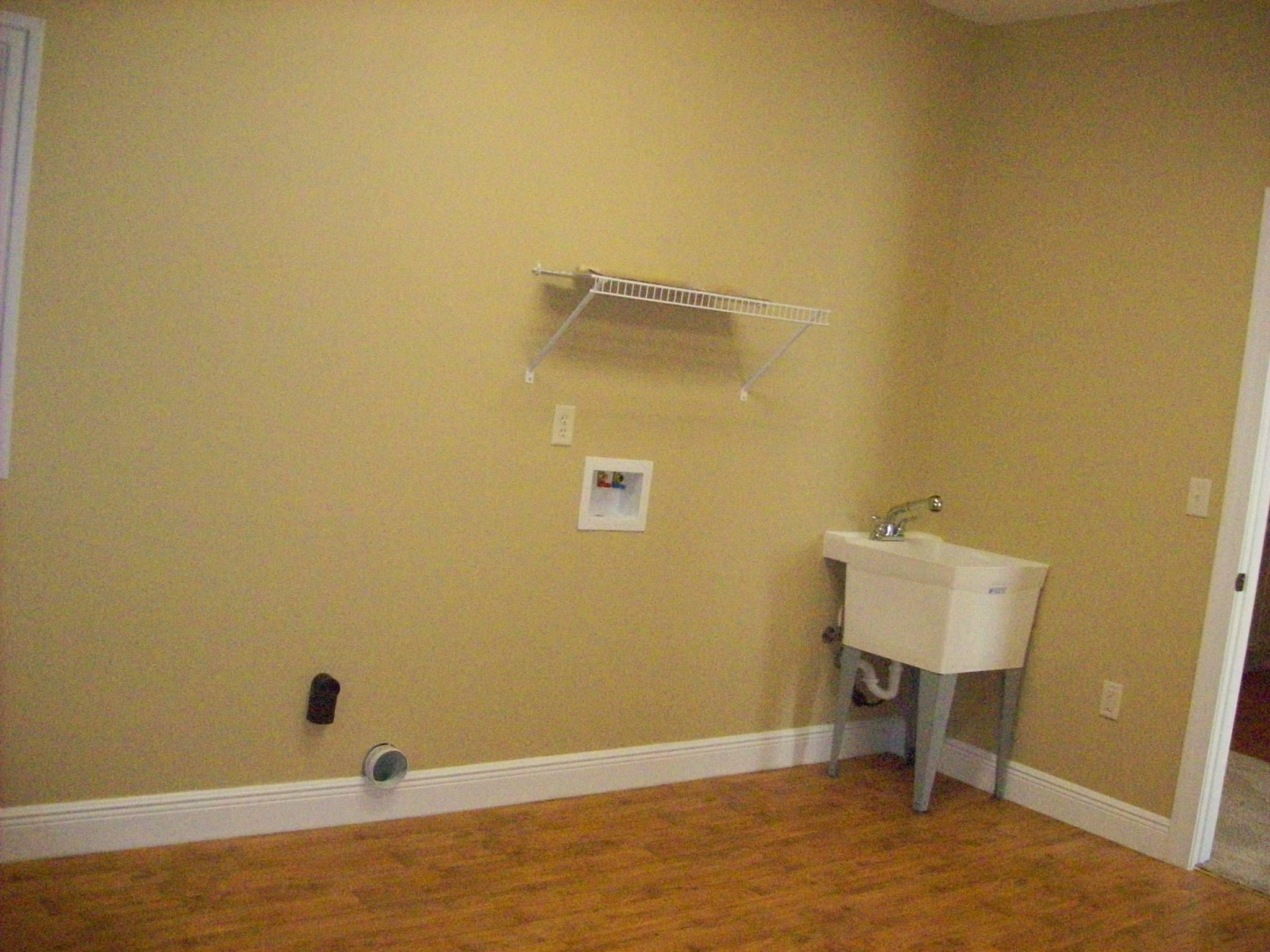 8130 Jordan Road Baker, FL 32531 - Photo 8 of 61 a view of a room with wooden floor and bench