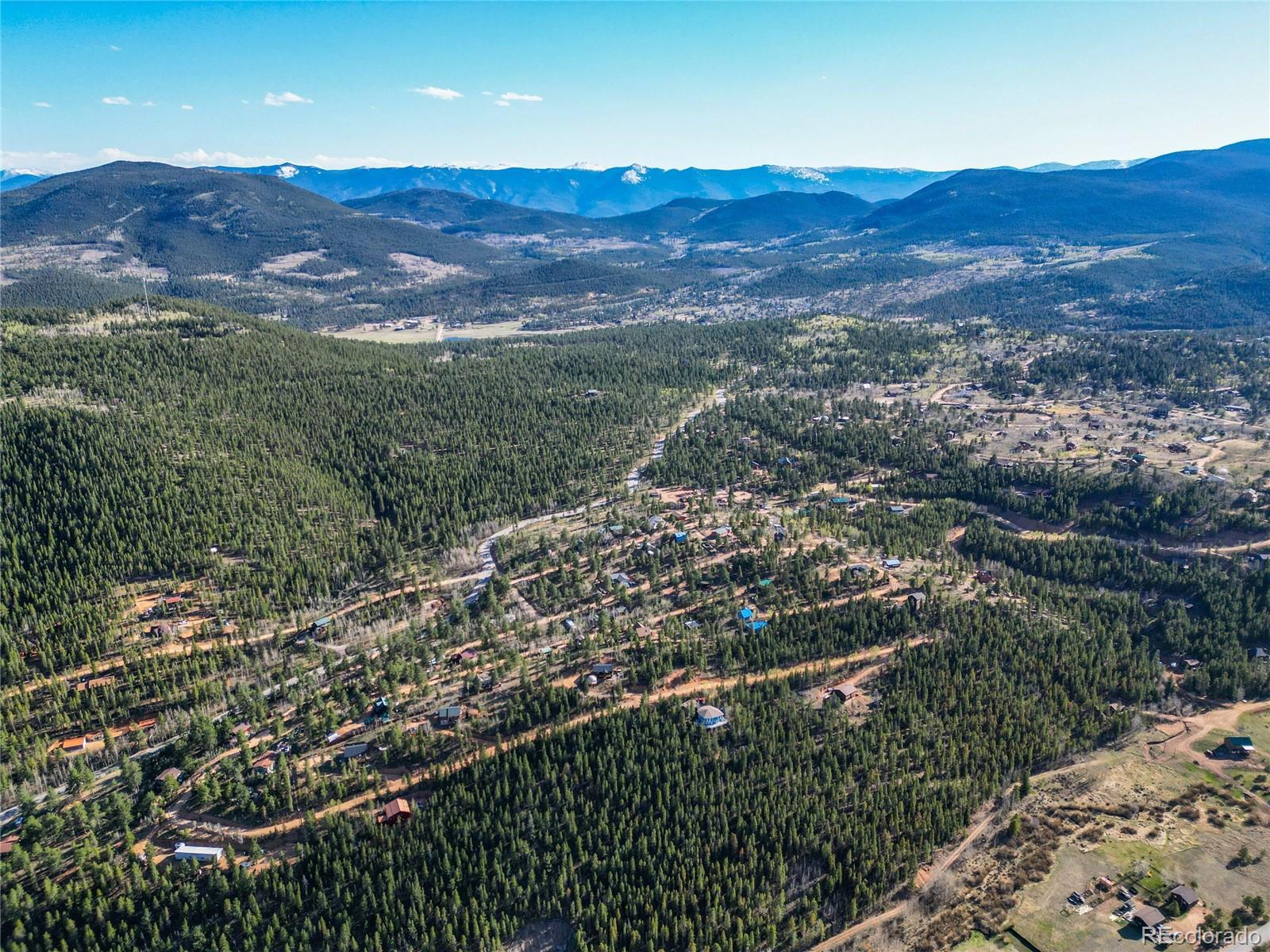 272 Wise Road Bailey, CO 80421 - Photo 19 of 21 a view of a city with mountains in the background