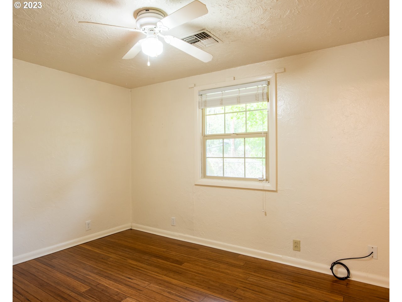 29853 Jarding Road Eugene, OR 97405 - Photo 18 of 30 an empty room with a window and wooden floor