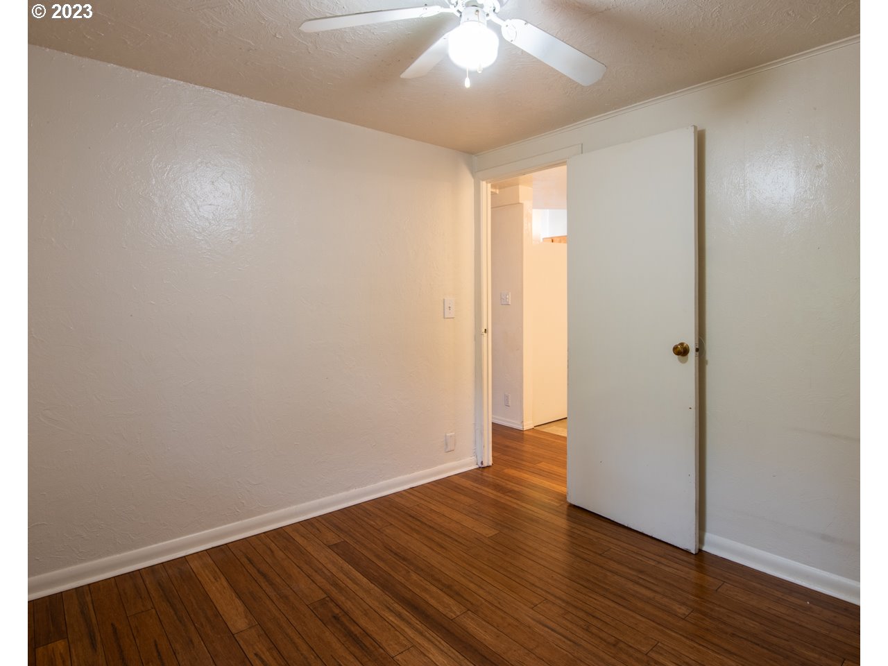 29853 Jarding Road Eugene, OR 97405 - Photo 19 of 30 an empty room with wooden floor and windows