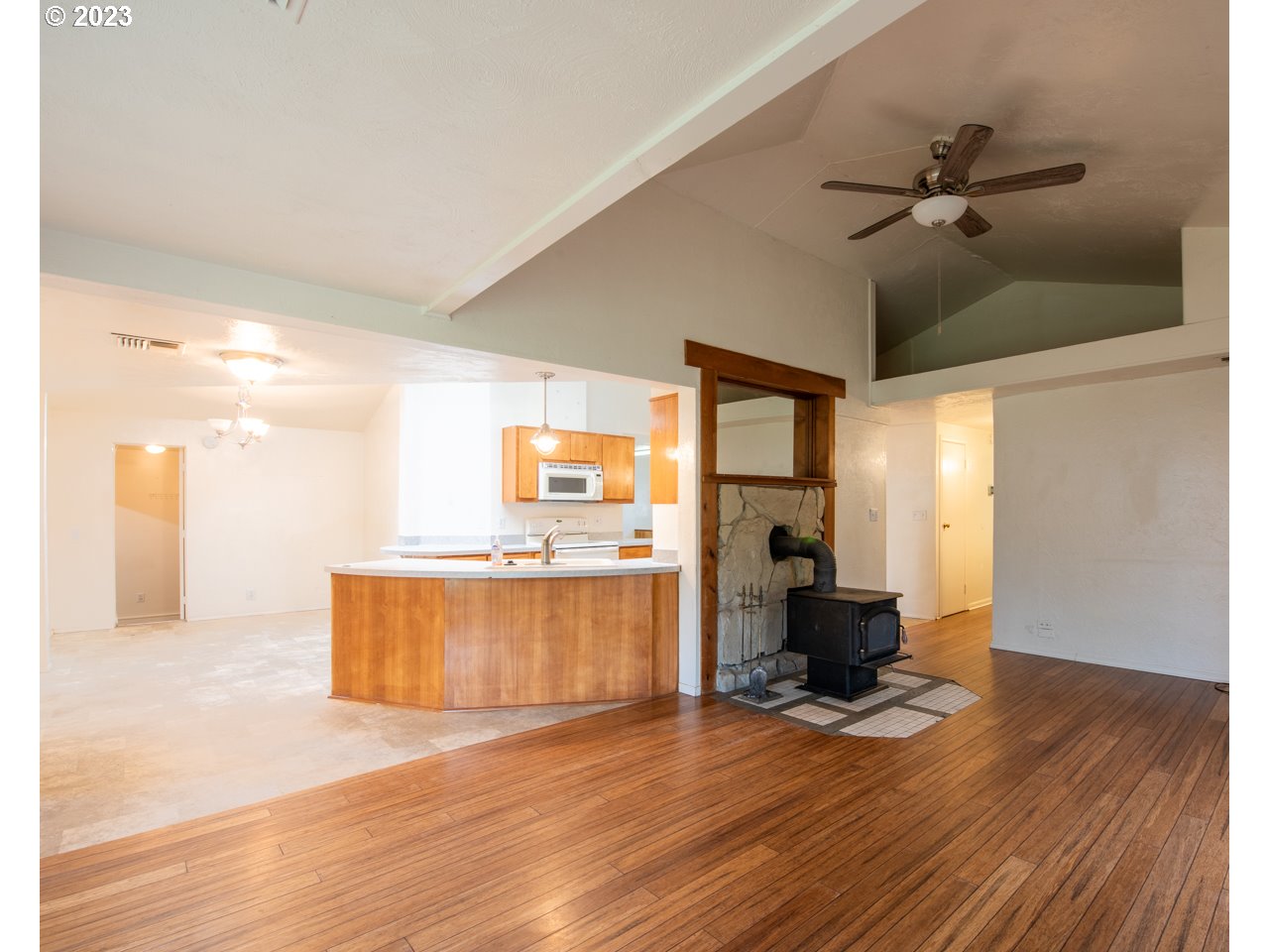 29853 Jarding Road Eugene, OR 97405 - Photo 2 of 30 a view of a living room a kitchen and a wooden floor