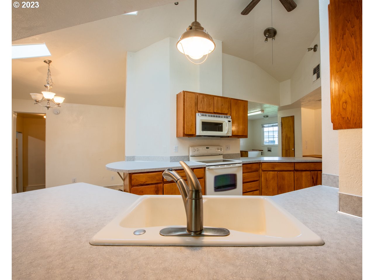 29853 Jarding Road Eugene, OR 97405 - Photo 5 of 30 a kitchen with stainless steel appliances granite countertop a sink a stove top oven a counter space and cabinets