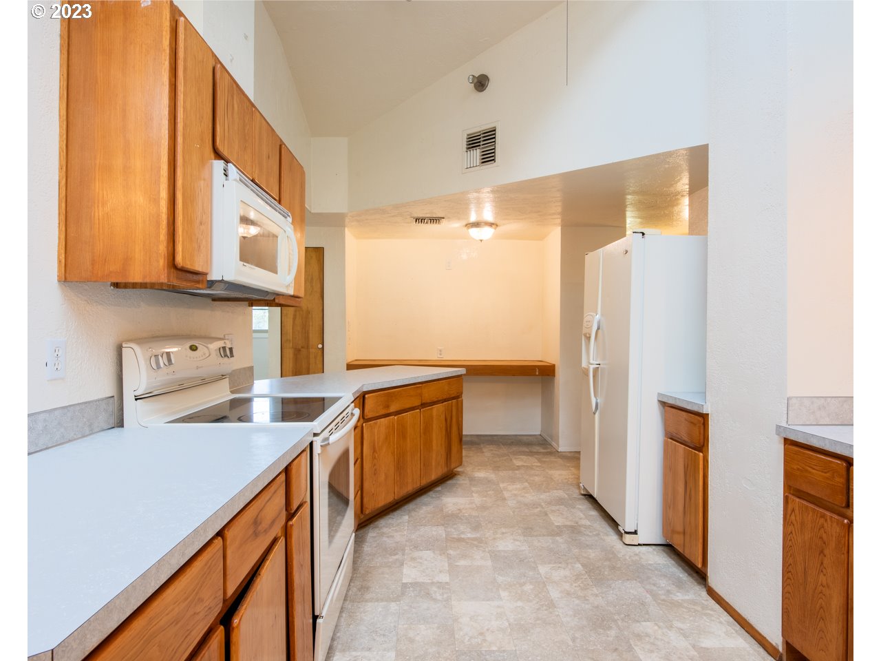 29853 Jarding Road Eugene, OR 97405 - Photo 6 of 30 a kitchen with granite countertop a sink stove and refrigerator
