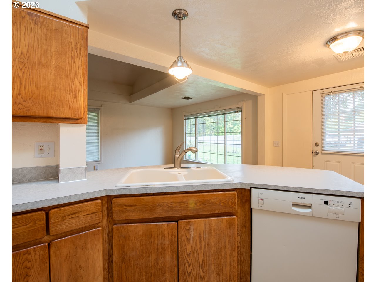 29853 Jarding Road Eugene, OR 97405 - Photo 7 of 30 a kitchen with a sink a stove a refrigerator and cabinets