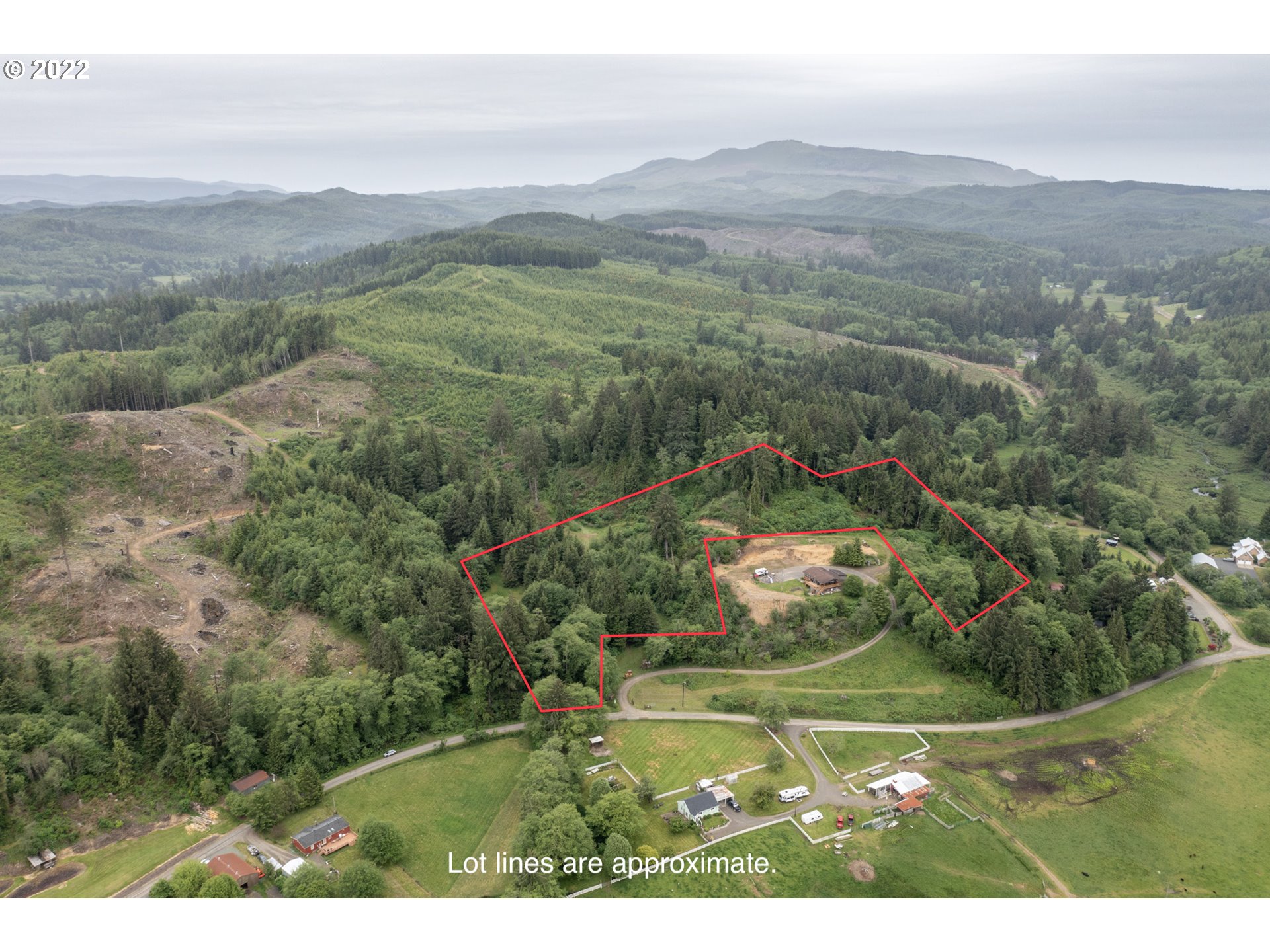 a view of a town with mountains in the background