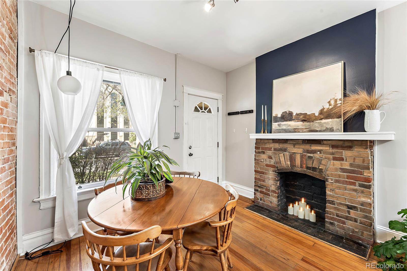2546 West 23rd Avenue, Unit B Denver, CO 80211 - Photo 3 of 17 a living room with furniture and a fireplace