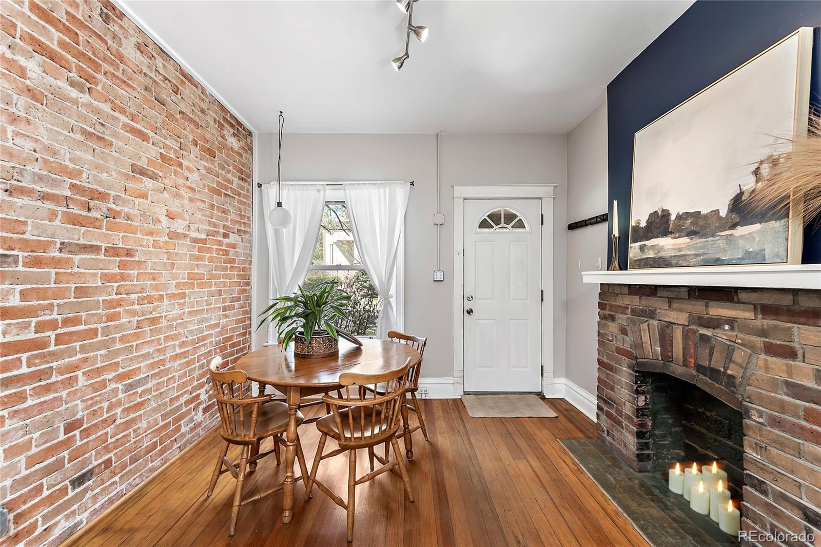 2546 West 23rd Avenue, Unit B Denver, CO 80211 - Photo 4 of 17 a view of a livingroom with furniture and fireplace
