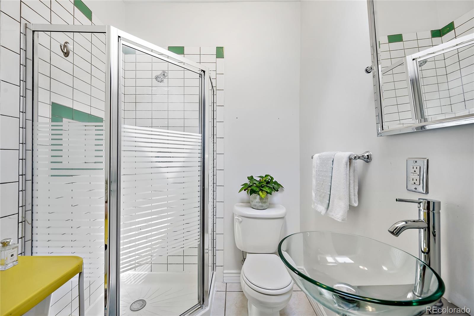 2546 West 23rd Avenue, Unit B Denver, CO 80211 - Photo 9 of 17 a bathroom with a granite countertop toilet sink and shower