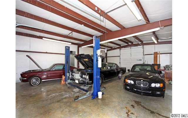 7945 Woodleaf Road Woodleaf, NC 27054 - Photo 13 of 16 a car parked in garage