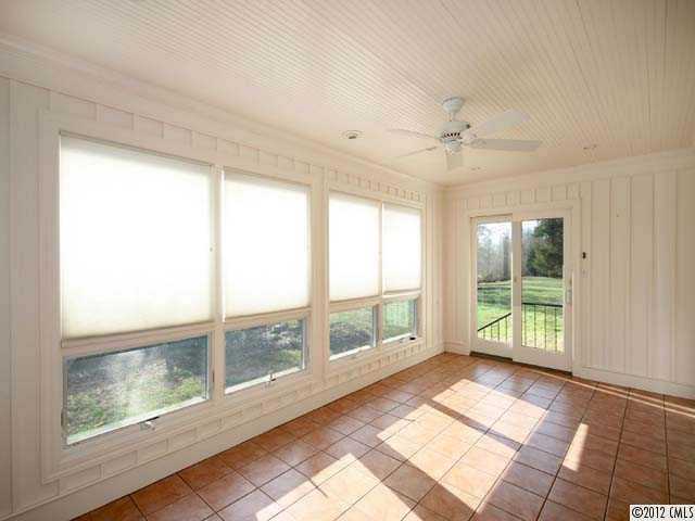7945 Woodleaf Road Woodleaf, NC 27054 - Photo 5 of 16 a view of an empty room with a window