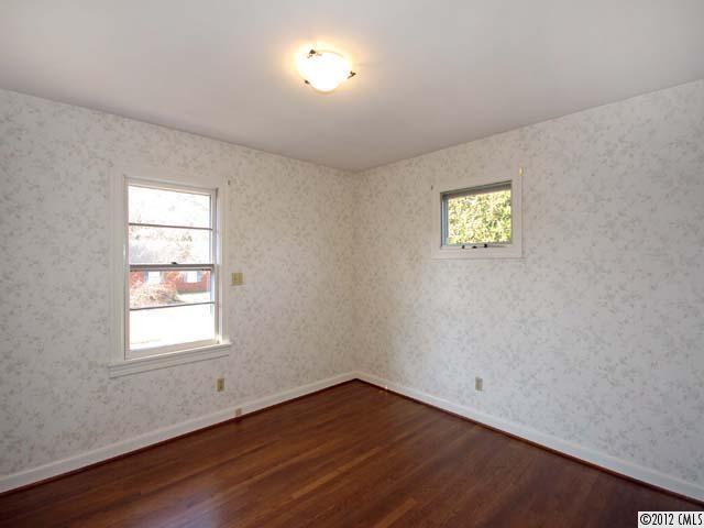 7945 Woodleaf Road Woodleaf, NC 27054 - Photo 7 of 16 an empty room with a window