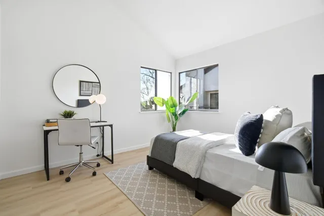 a bedroom with a bed and window