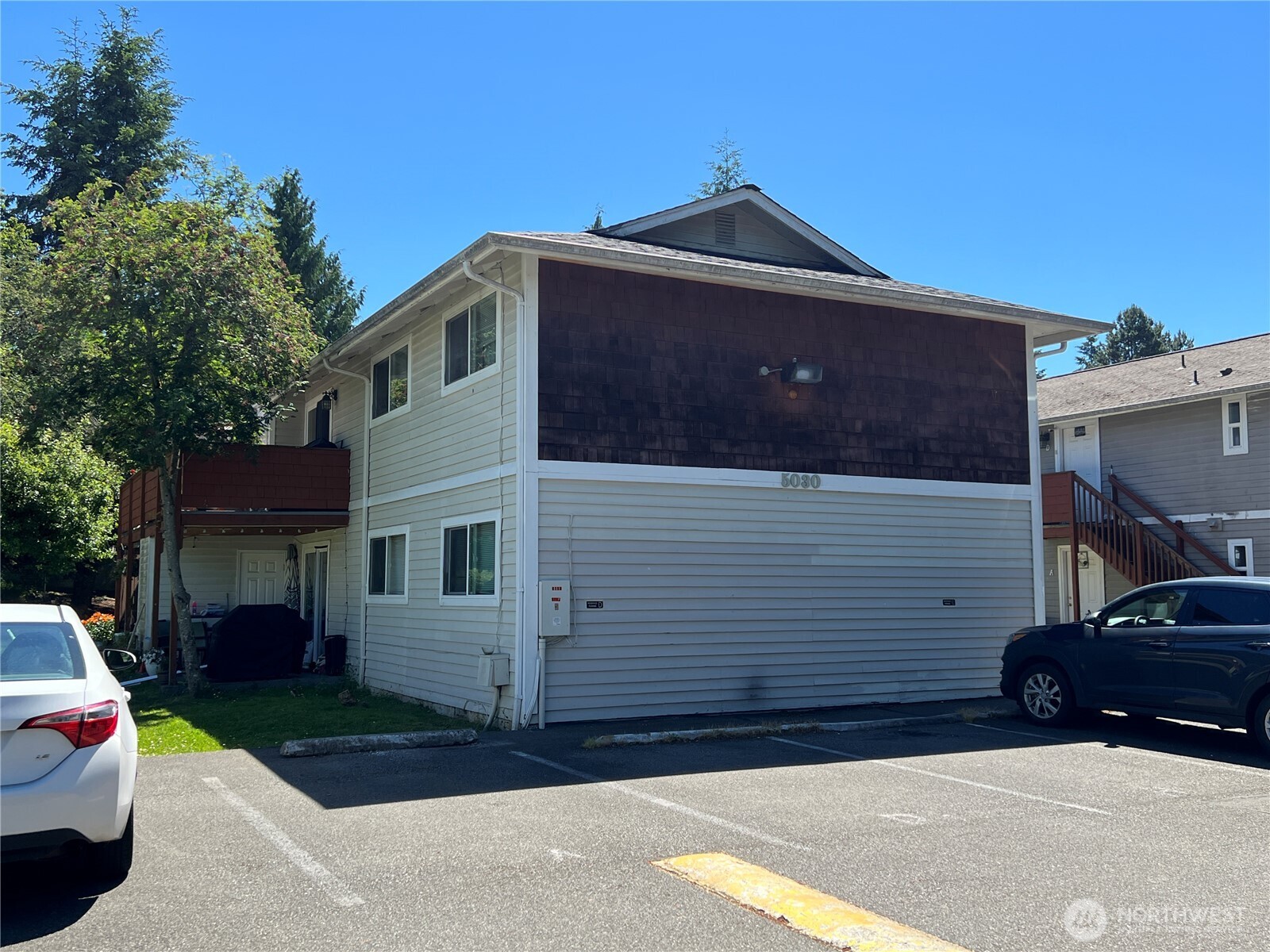 5030 212th Street Southwest Mountlake Terrace, WA 98043 - Photo 1 of 14 a front view of a house with a garden