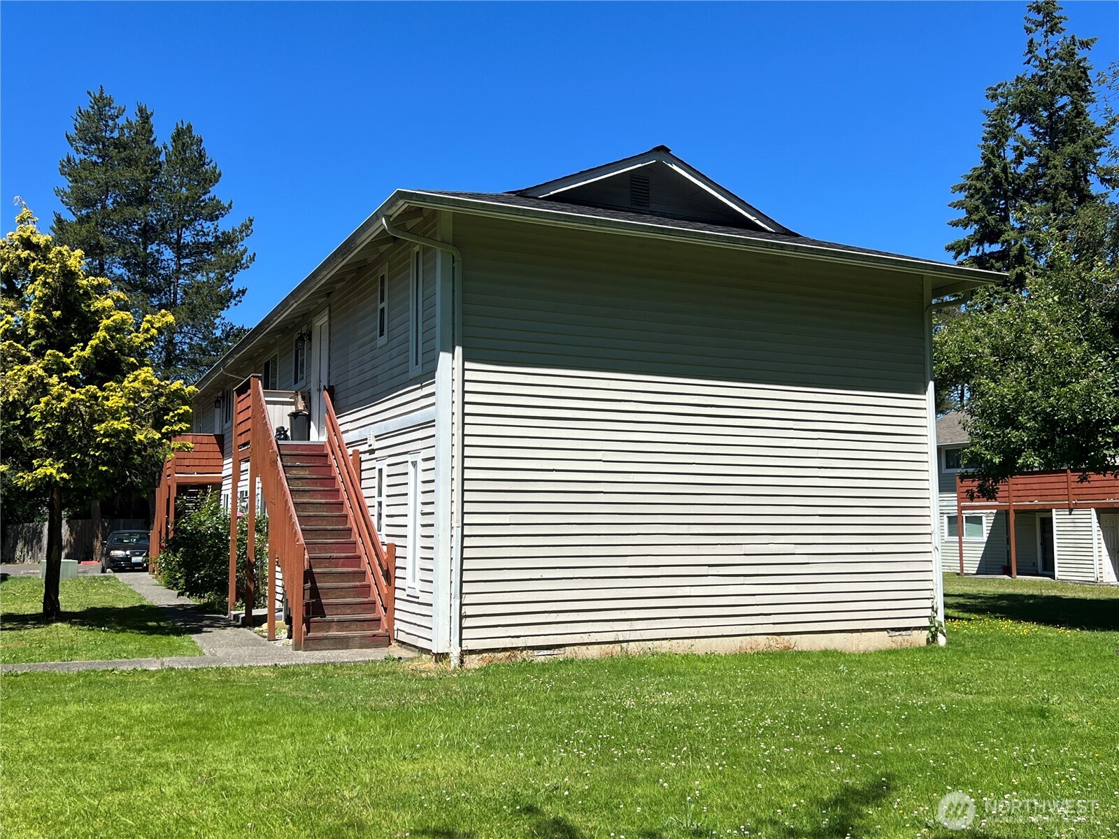 5030 212th Street Southwest Mountlake Terrace, WA 98043 - Photo 3 of 14 a front view of a house with a yard