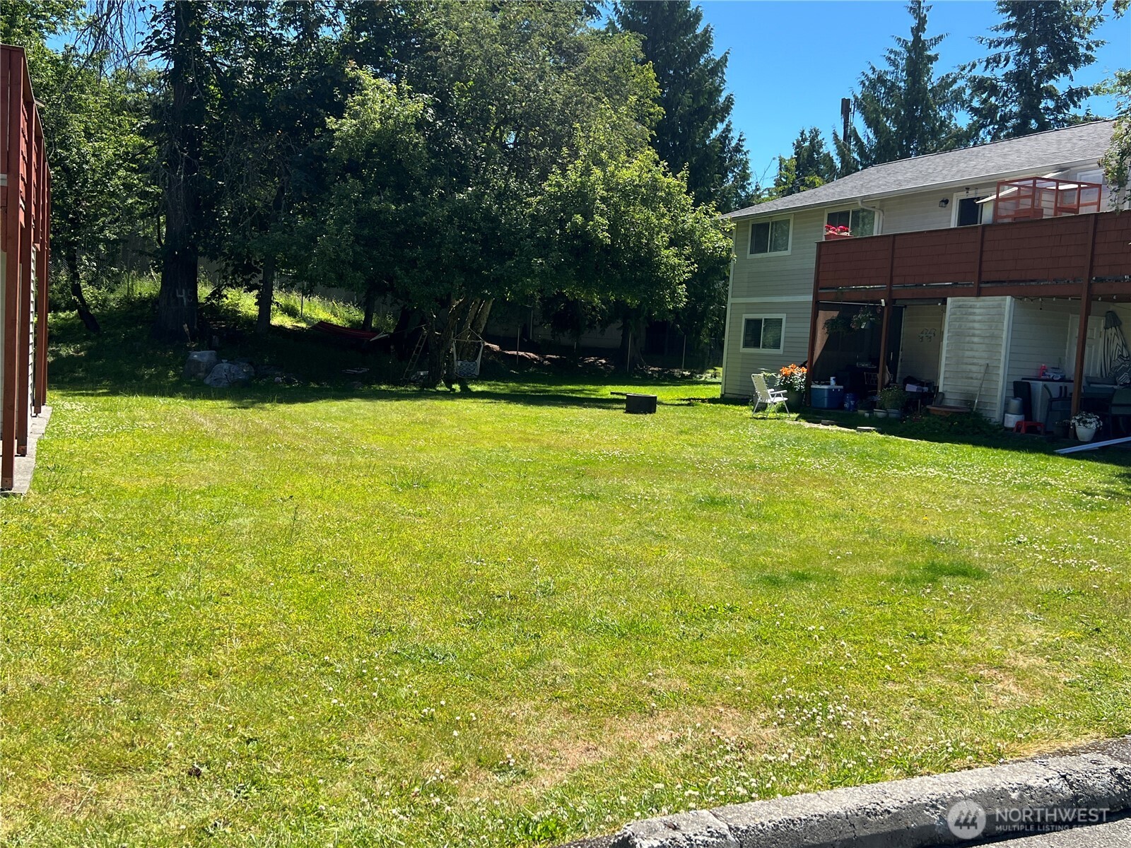 5030 212th Street Southwest Mountlake Terrace, WA 98043 - Photo 5 of 14 a view of a house with a yard and sitting area