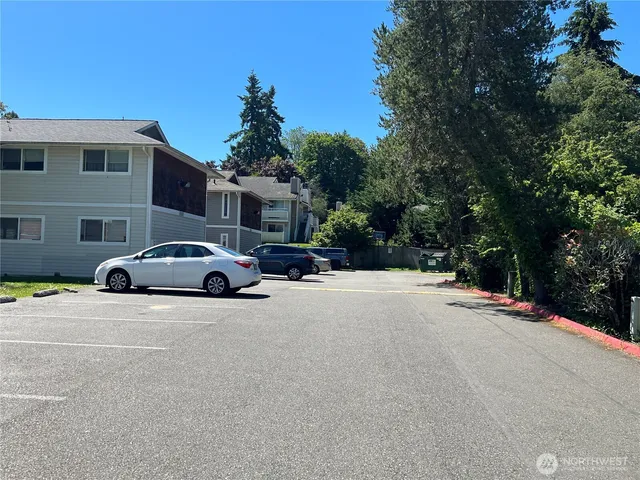 a view of street with parked cars