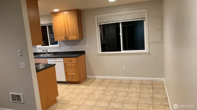 a view of a kitchen with a sink and a stove