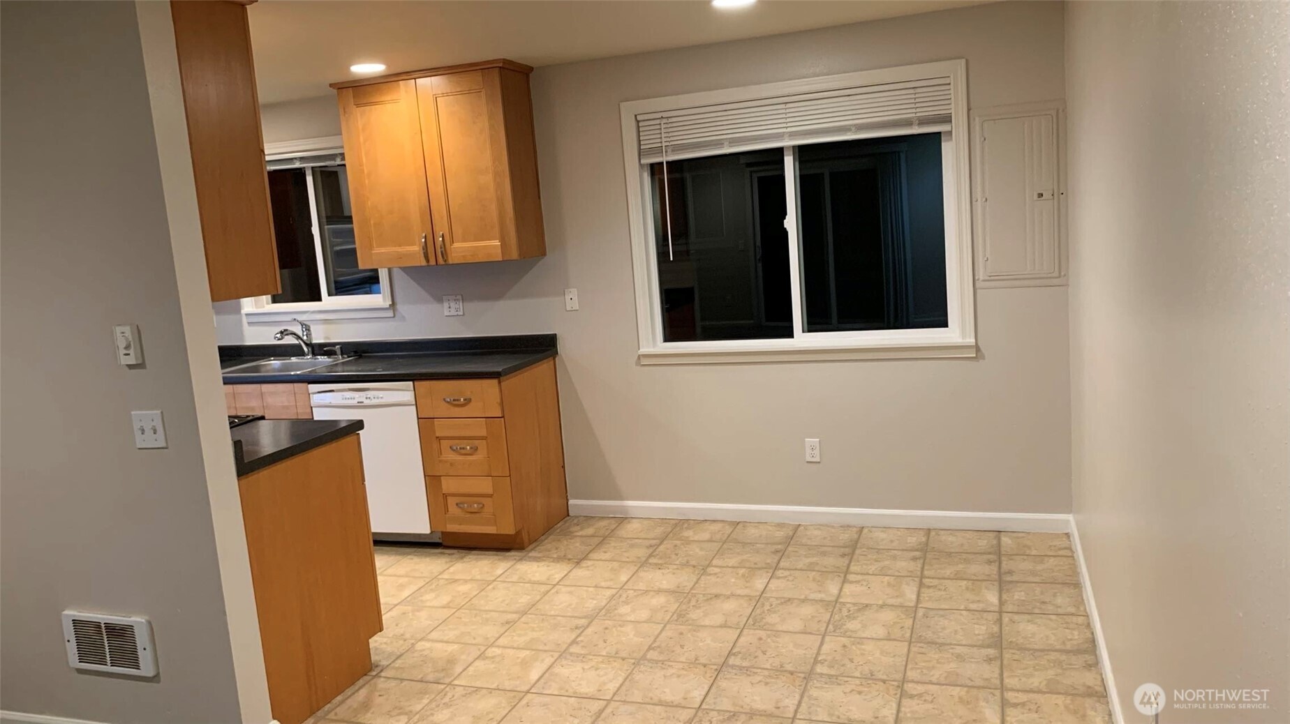 5030 212th Street Southwest Mountlake Terrace, WA 98043 - Photo 8 of 14 a view of a kitchen with a sink and a stove