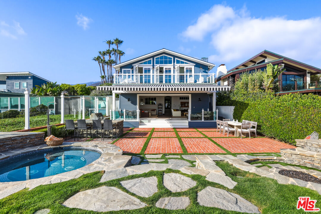 30810 Broad Beach Road Malibu, CA 90265 - Photo 7 of 55 a view of a house with swimming pool and sitting area