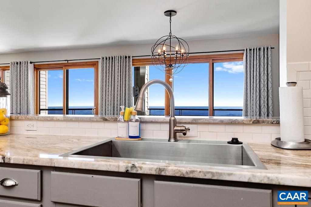 1581 Vistas Roseland, VA 22967 - Photo 19 of 53 a kitchen with a sink and a wooden floor