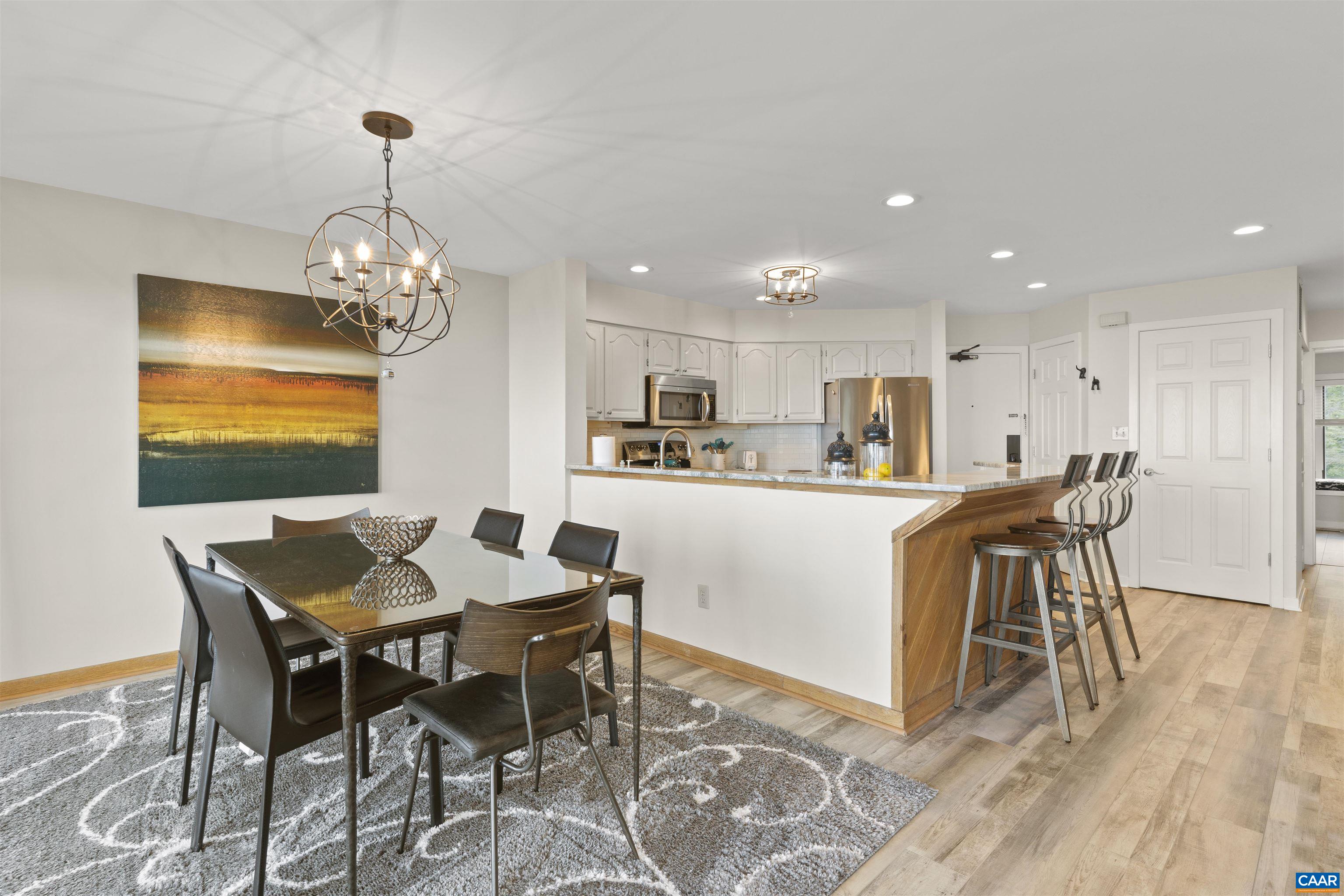 1581 Vistas Roseland, VA 22967 - Photo 23 of 53 a view of a dining room with furniture and wooden floor