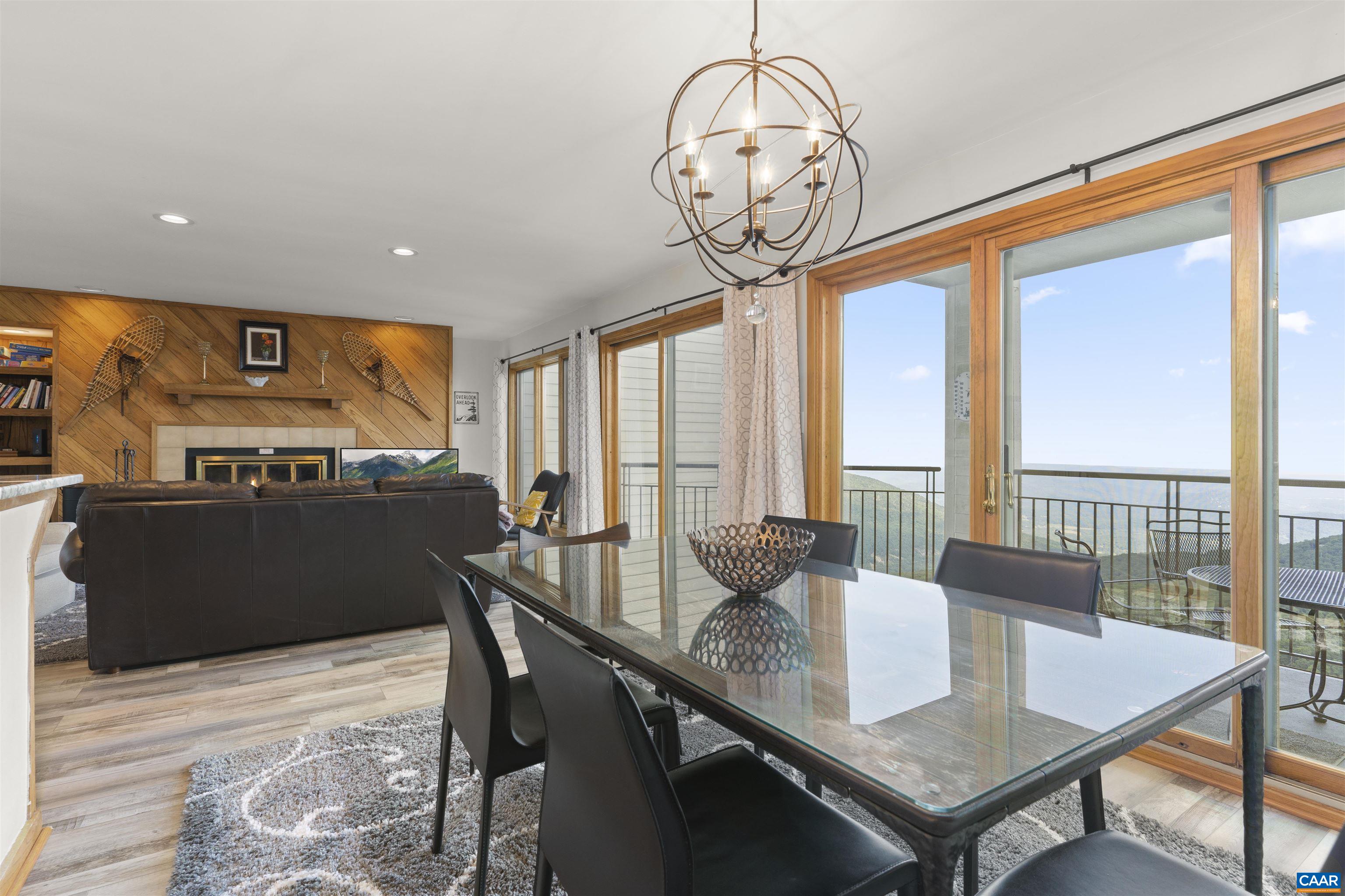 1581 Vistas Roseland, VA 22967 - Photo 28 of 53 a view of a dining room with furniture large windows and wooden floor