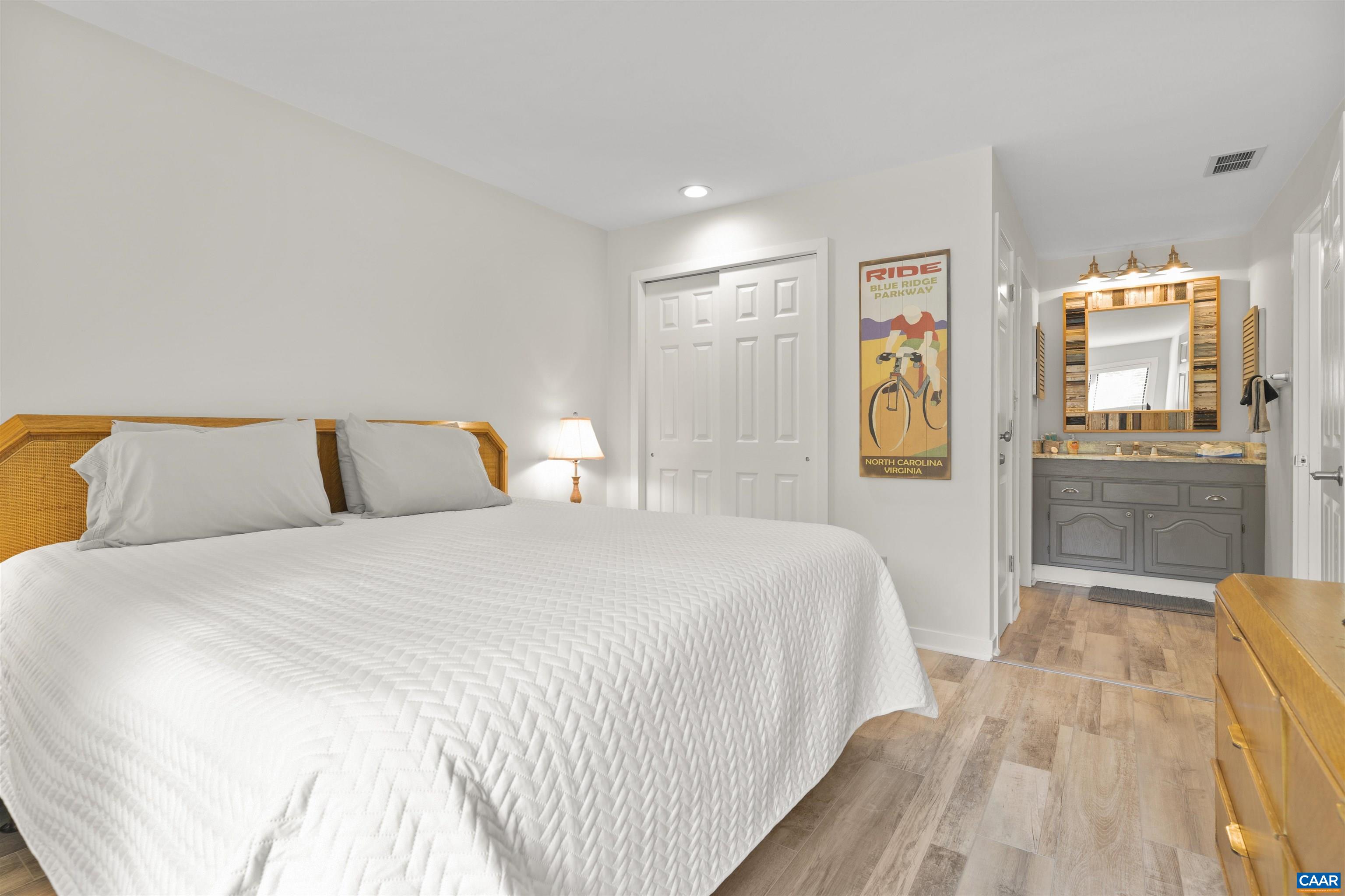 1581 Vistas Roseland, VA 22967 - Photo 33 of 53 a bedroom with a bed and wooden floor