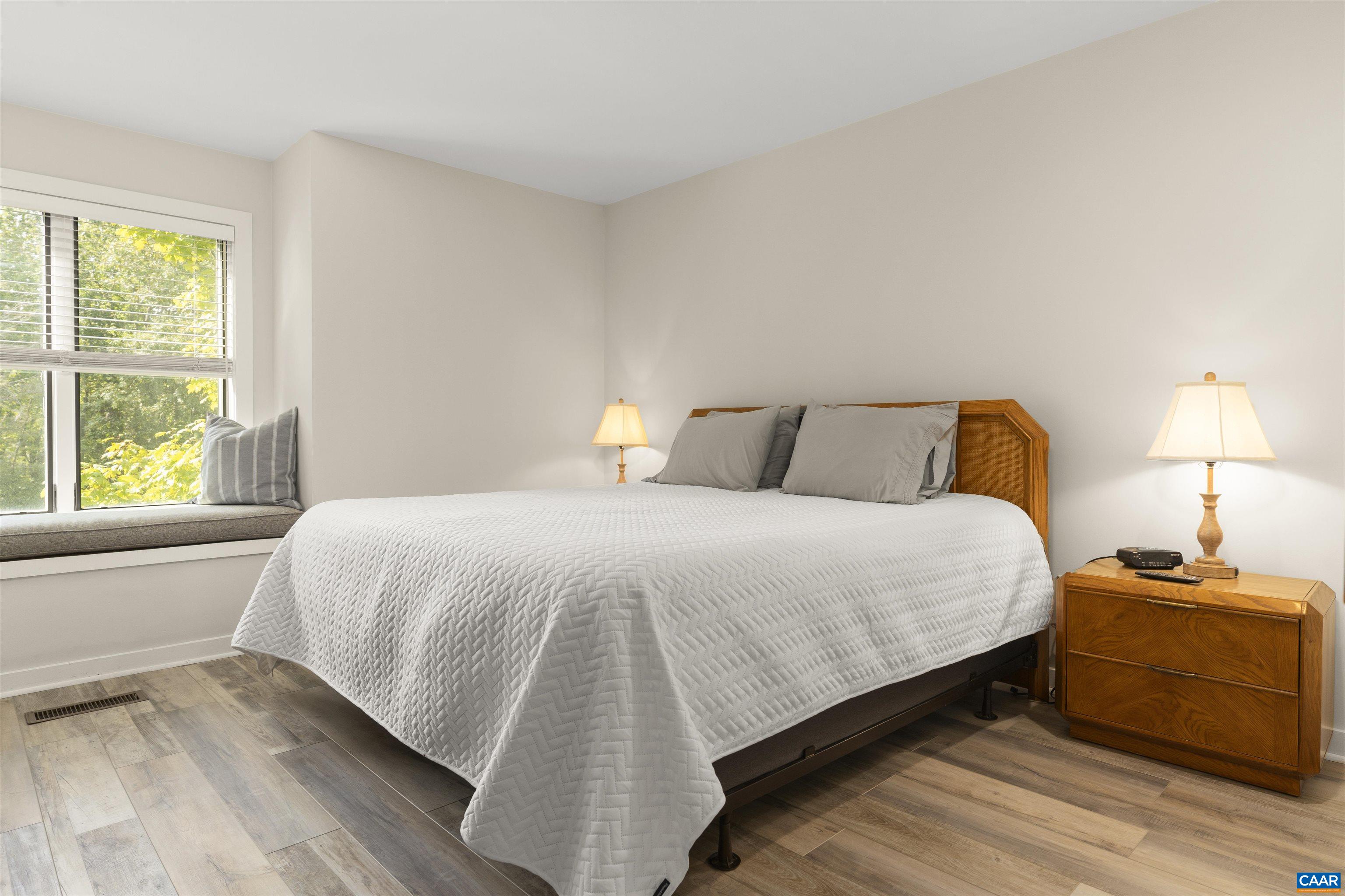 1581 Vistas Roseland, VA 22967 - Photo 34 of 53 a bedroom with a bed and wooden floor