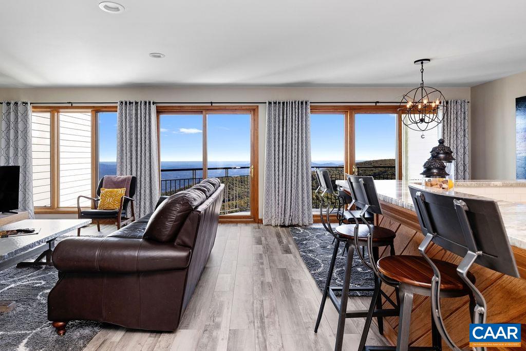 1581 Vistas Roseland, VA 22967 - Photo 6 of 53 a work room with furniture and a flat screen tv