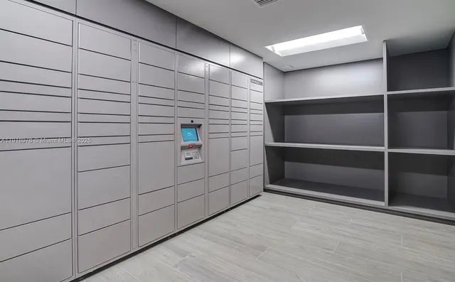 a media room with lots of chairs and a projector screen