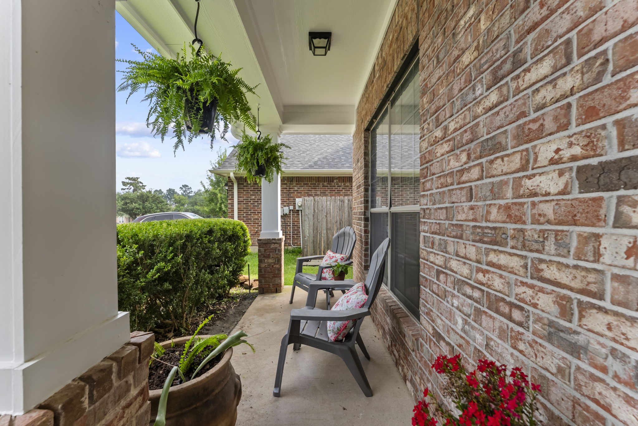 2106 Leaf Meadows Court Spring, TX 77386 - Photo 7 of 34 a porch with a bench and a potted plant