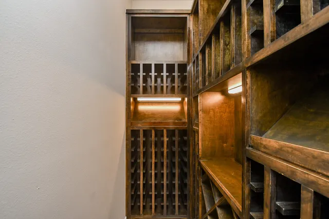a view of staircase with railing and a window
