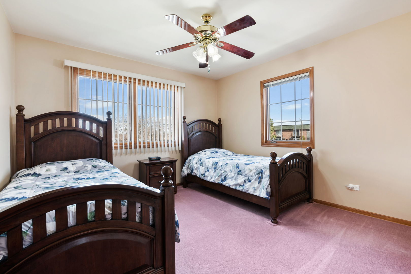 1612 Percy Lane Itasca, IL 60143 - Photo 12 of 20 a bedroom with a bed a dresser and a window