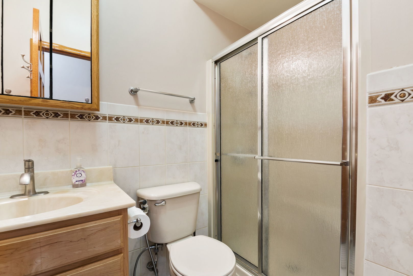 1612 Percy Lane Itasca, IL 60143 - Photo 14 of 20 a bathroom with a sink toilet and shower