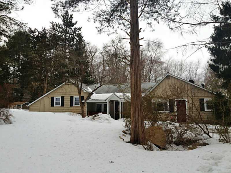 Exterior Front. This home sits back from the road to give you the privacy and sought out country feeling. It was completely remodeled in 2011, inside and out. The farmers porch with columns gives this home tons of architectural & curb appeal.