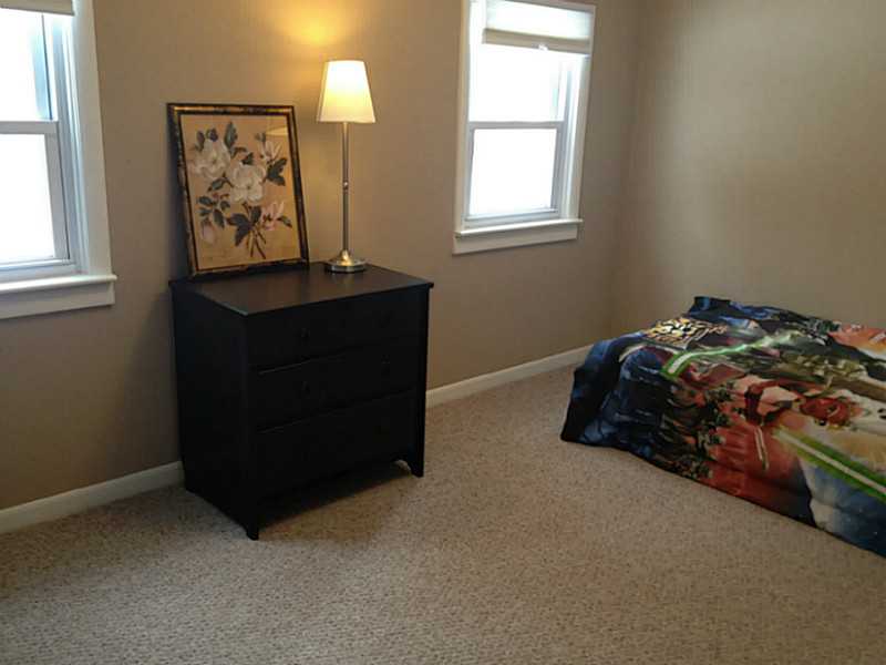 293 Hope Furnace Road Scituate, RI 02831 - Photo 10 of 14 Bedroom. One of the three Bedrooms. Newly painted walls, newer windows also throughout the home.