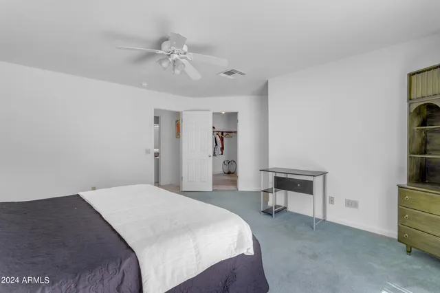a kitchen with a sink cabinets and window