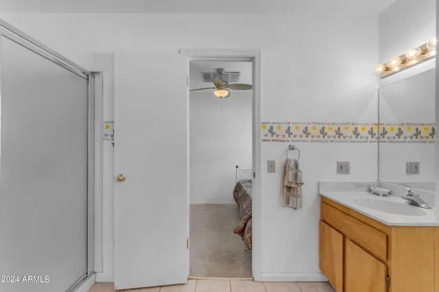 an aerial view of a house with a yard and lake view