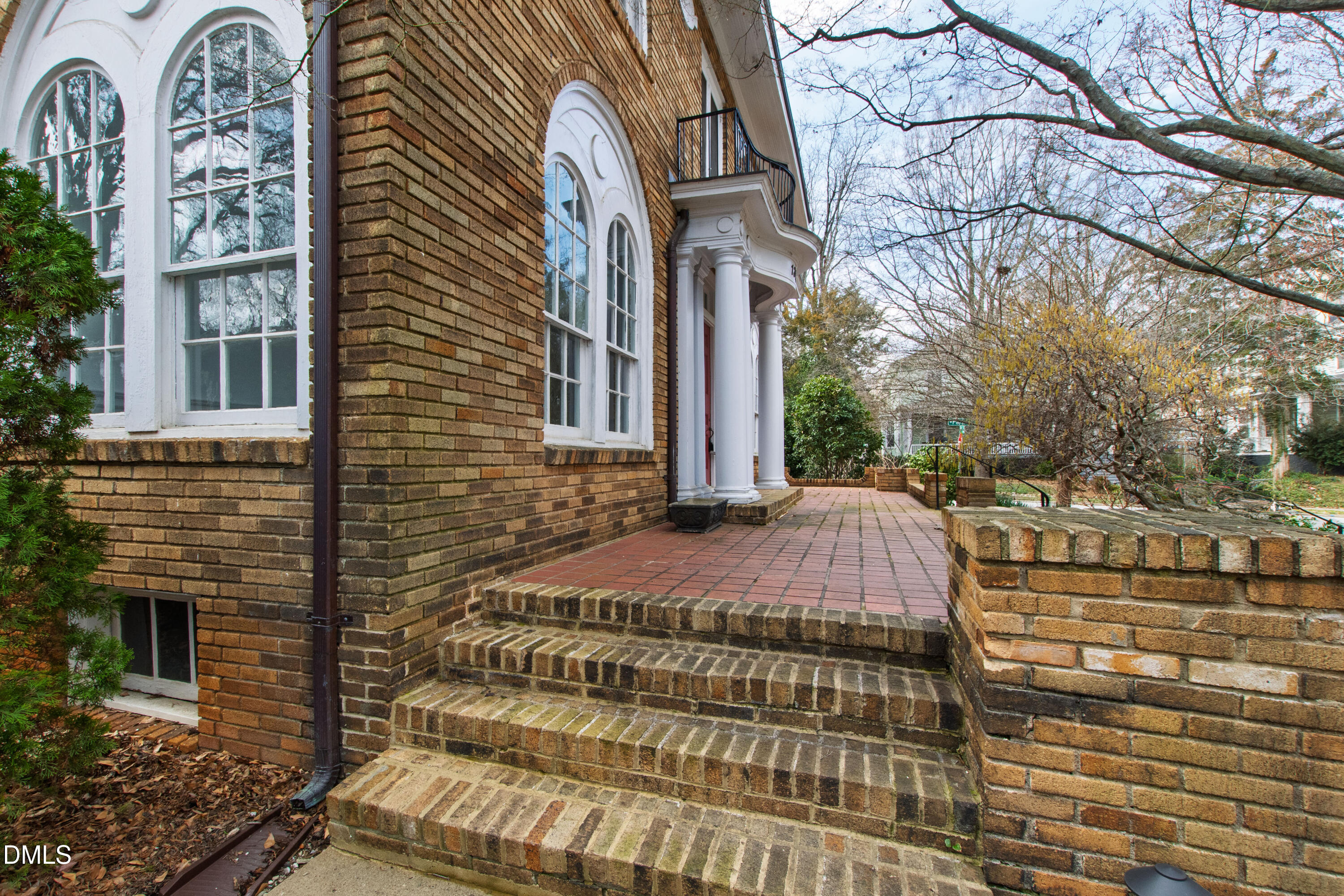 1313 College Place Raleigh, NC 27605 - Photo 15 of 71 a view of a brick building next to a yard