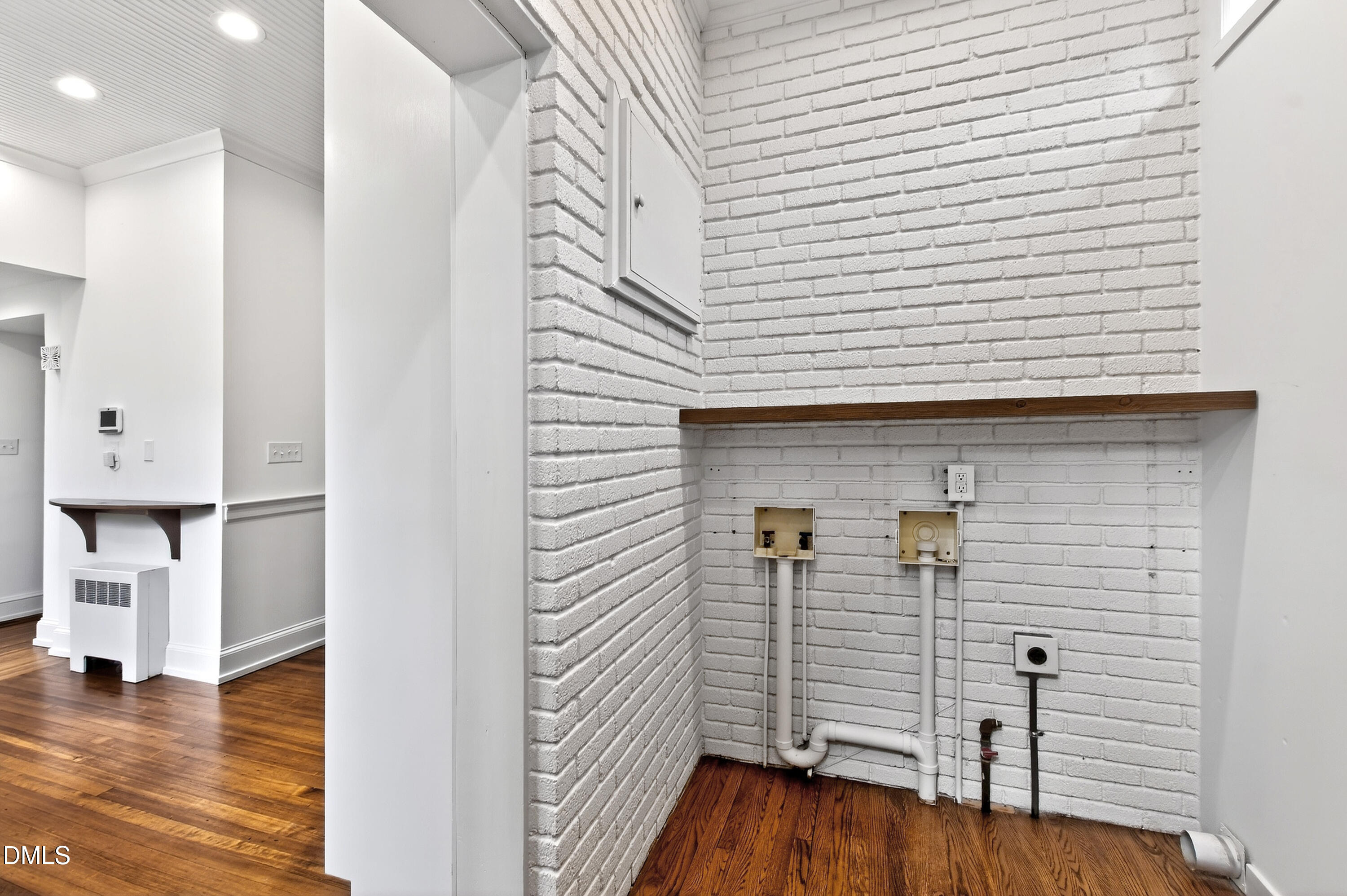 1313 College Place Raleigh, NC 27605 - Photo 33 of 71 a view of a hallway with wooden floor and staircase