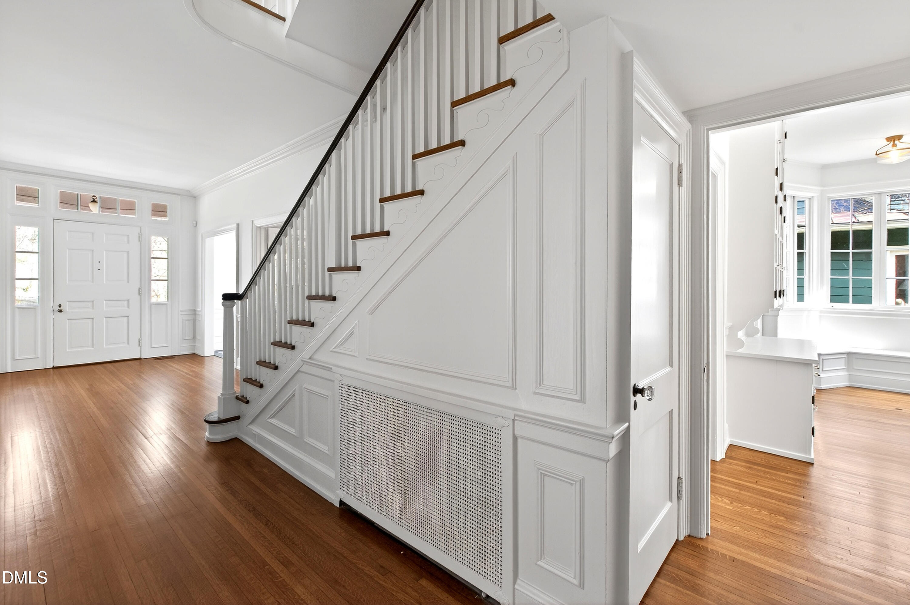 1313 College Place Raleigh, NC 27605 - Photo 35 of 71 a view of entryway with wooden floor and staircase