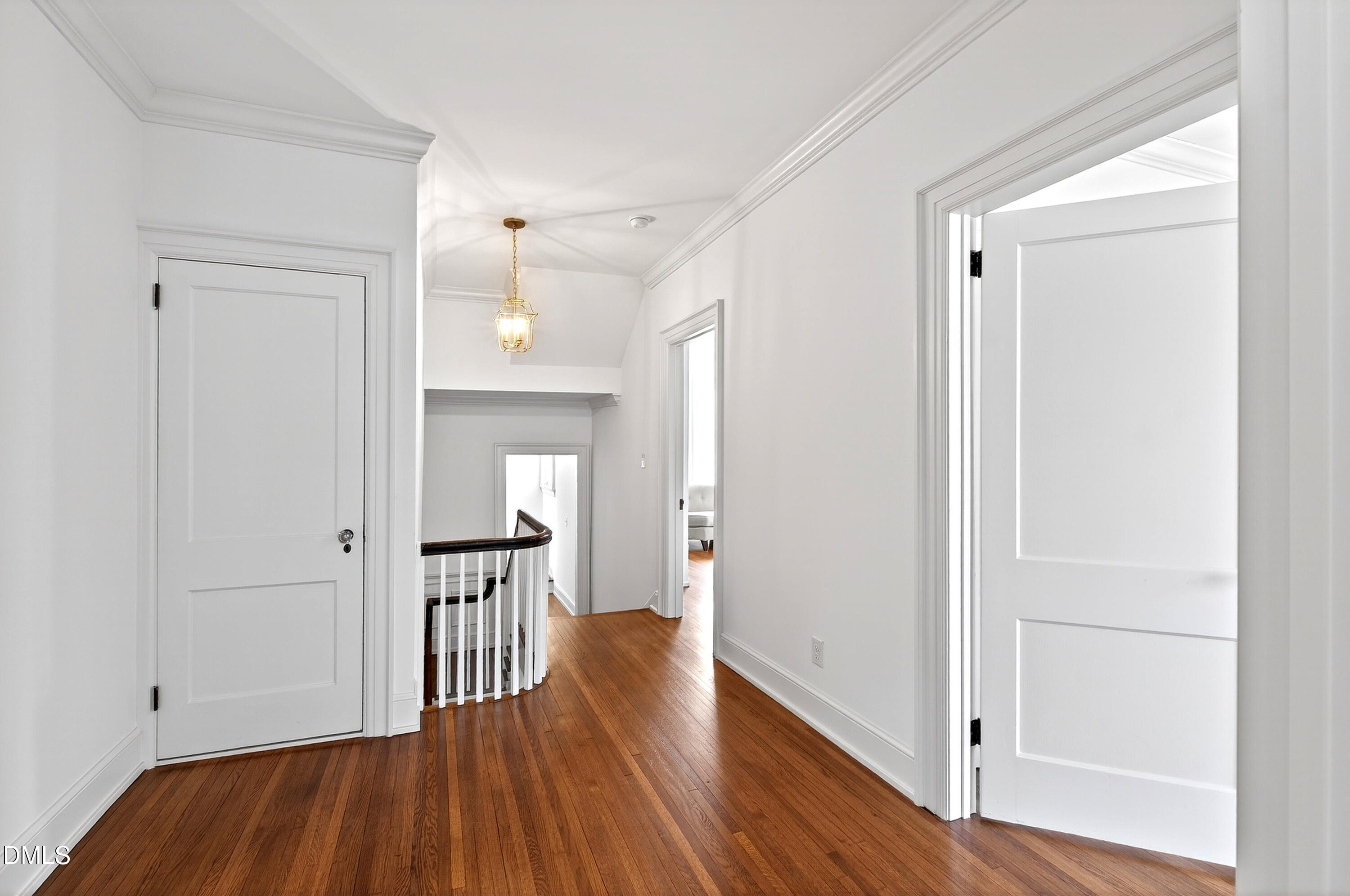 1313 College Place Raleigh, NC 27605 - Photo 38 of 71 a view of a hallway view with wooden floor and staircase